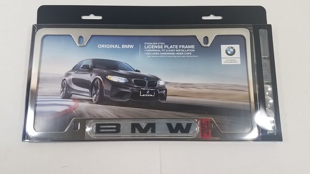 82120010395 - Exterior: License Plate Frame, Stainless Steel for BMW: 128i, 135i, 135is, 228i, 228i xDrive, 230i, 230i xDrive, 320i, 320i xDrive, 328d, 328d xDrive, 328i, 328i xDrive, 330e, 330i, 330i GT xDrive, 330i xDrive, 335d, 335i, 335i GT xDrive, 335i xDrive, 335is, 340i, 340i GT xDrive, 340i xDrive, 428i, 428i xDrive, 430i, 430i Gran Coupe, 430i xDrive, 435i, 435i xDrive, 440i, 440i xDrive, 528i, 528i xDrive, 530i, 530i xDrive, 535d, 535d xDrive, 535i, 535i GT, 535i GT xDrive, 535i xDrive, 540d xDrive, 540i, 540i xDrive, 550i, 550i GT xDrive, 550i xDrive, 640i, 640i Gran Coupe, 640i xDrive, 640i xDrive Gran Coupe, 640i xDrive Gran Turismo, 650i, 650i Gran Coupe, 650i xDrive, 650i xDrive Gran Coupe, 740e xDrive, 740i, 740i xDrive, 740Li, 740Li xDrive, 750i, 750i xDrive, 750Li, 750Li xDrive, 760Li, 840i, 840i Gran Coupe, Alpina B6 xDrive Gran Coupe, Alpina B7, M2, M235i, M235i xDrive, M240i, M240i xDrive, M3, M340i, M4, M440i Gran Coupe, M5, M550i xDrive, M6, M6 Gran Coupe, M760i xDrive, M8, X1, X2, X3, X4, X5, X6, X7, Z4 Image