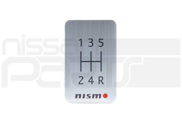 96935RN000 - : NISMO 5-SPEED BADGE for Nissan: 200SX, 240SX, 280ZX, 300ZX, 310, 350Z, 370Z, 720, Altima, Armada, Axxess, Cube, Frontier, GT-R, Juke, Kicks, Maxima, Murano, NV1500, NV200, NV2500, NV3500, Pathfinder, Pathfinder Armada, Pulsar NX, Quest, Rogue, Rogue Select, Sentra, Stanza, TITAN, TITAN XD, Van, Versa, Versa Note, Xterra Image