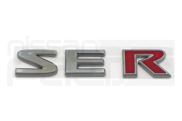 84896ZJ60E - : "SE-R" REAR BADGE / NAMEPLATE (B16 SENTRA) for Nissan: Sentra Image