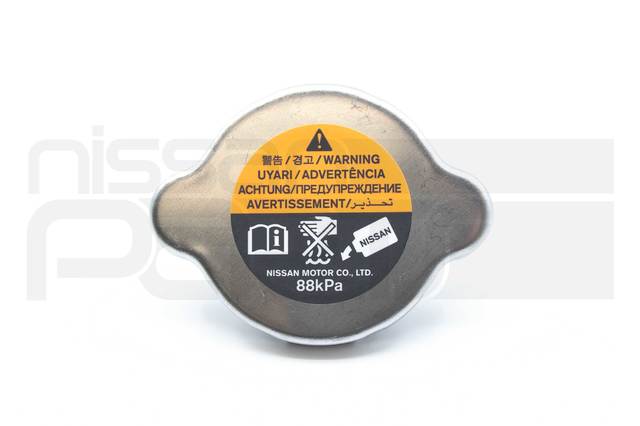 214307999C - : RADIATOR CAP (B13 B14 D21 S12 S13 S14 Z31) for Nissan: 200SX, 240SX, 300ZX, 350Z, 370Z, 720, Altima, Axxess, Cube, D21, Frontier, Juke, Maxima, Murano, NV200, NX, Pathfinder, Pickup, Pulsar NX, Quest, Rogue, Rogue Select, Sentra, Stanza, Van, Versa, Versa Note, Xterra Image