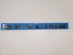 84895AB000 - : JDM Nissan R34 Skyline GTT Rear Trunk Lid "Skyline" Emblem for Nismo Image