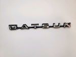6280025500 - : GENUINE DATSUN 240Z 260Z 280Z Metal 2 Nipple "Datsun" Emblem for Nissan Image