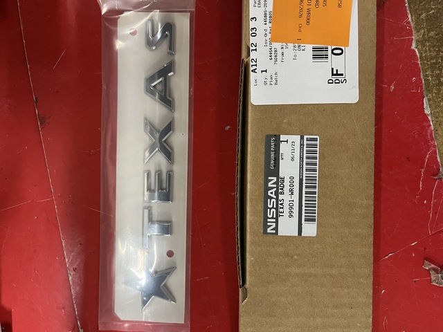 999D1WR000 - Exterior: Texas Titan Rear Tail Gate Badge for Nissan Image