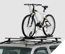 12497223 - Cargo Management: Roof Bicycle Carrier for Buick: Century, LeSabre, Park Avenue, Rainier, Regal, Rendezvous | Cadillac: CTS, DeVille, Eldorado, Escalade, Escalade ESV, Escalade EXT, SRX | Chevrolet: Astro, Blazer, Cavalier, Impala, Malibu, Prizm, Suburban 1500, Suburban 2500, Suburban C1500, Suburban C2500, Suburban K1500, Suburban K2500, Tahoe, Tracker, Trailblazer, Trailblazer EXT, Venture | GMC: Envoy, Envoy XL, Jimmy, Safari, Yukon, Yukon XL 1500, Yukon XL 2500 Image