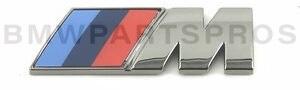 51148090642 - : BMW OEM CERIUM GREY "///M" FENDER BADGE for BMW: 330e, 330e xDrive, 330i, 330i xDrive, 840i, 840i xDrive, M3, M340i, M340i xDrive, M8 Gran Coupe, M850i xDrive, Z4 Image
