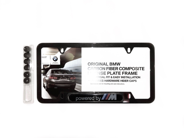 82125A1C497 - Exterior: License Plate Frame, Powered by M for BMW: 230i, 320i, 328d, 330e, 330i, 330i GT xDrive, 340i, 340i GT xDrive, 430i, 430i Gran Coupe, 440i, 530i, 535i GT, 540i, 550i GT xDrive, 640i, 640i Gran Coupe, 640i xDrive Gran Turismo, 650i, 650i Gran Coupe, 740i, 750i, 840i, 840i Gran Coupe, Alpina B6 xDrive Gran Coupe, Alpina B7, M2, M240i, M3, M340i, M4, M440i Gran Coupe, M5, M550i xDrive, M6, M6 Gran Coupe, M760i xDrive, M8, X1, X2, X3, X4, X5, X6, X7, Z4 Image