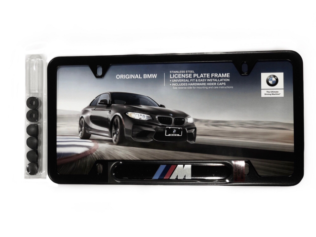 82120010404 - Exterior: License Plate Frame, M Logo for BMW: 128i, 135i, 135is, 228i, 228i xDrive, 230i, 230i xDrive, 320i, 320i xDrive, 328d, 328d xDrive, 328i, 328i xDrive, 330e, 330i, 330i GT xDrive, 330i xDrive, 335i, 335i GT xDrive, 335i xDrive, 335is, 340i, 340i GT xDrive, 340i xDrive, 428i, 428i xDrive, 430i, 430i Gran Coupe, 430i xDrive, 435i, 435i xDrive, 440i, 440i xDrive, 528i, 528i xDrive, 530i, 530i xDrive, 535d, 535d xDrive, 535i, 535i GT, 535i GT xDrive, 535i xDrive, 540d xDrive, 540i, 540i xDrive, 550i, 550i GT xDrive, 550i xDrive, 640i, 640i Gran Coupe, 640i xDrive, 640i xDrive Gran Coupe, 640i xDrive Gran Turismo, 650i, 650i Gran Coupe, 650i xDrive, 650i xDrive Gran Coupe, 740e xDrive, 740i, 740i xDrive, 740Li, 740Li xDrive, 750i, 750i xDrive, 750Li, 750Li xDrive, 760Li, 840i, 840i Gran Coupe, Alpina B6 xDrive Gran Coupe, Alpina B7, M2, M235i, M235i xDrive, M240i, M240i xDrive, M3, M340i, M4, M440i Gran Coupe, M5, M550i xDrive, M6, M6 Gran Coupe, M760i xDrive, M8, X1, X2, X3, X4, X5, X6, X7, Z4 Image
