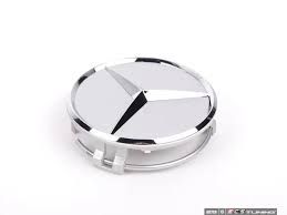 66470202 - Wheels: Wheel Hub Insert - Silver Cap Silver Logo for Mercedes-Benz: B Electric Drive, B250e, C250, C300, C350, C63 AMG, CLA250, CLA45 AMG, CLK320, CLK350, CLK500, CLK55 AMG, CLK550, CLK63 AMG, CLS400, CLS500, CLS55 AMG, CLS550, CLS63 AMG, CLS63 AMG S, E350, E400, E550, E63 AMG, GL320, GL350, GL450, GL550, GL63 AMG, GLA250, GLA45 AMG, GLC300, GLC350e, GLC43 AMG, GLC63 AMG, GLC63 AMG S, GLE300d, GLE350, GLE400, GLE43 AMG, GLE450 AMG, GLE550e, GLE63 AMG, GLE63 AMG S, GLK250, GLK350, GLS350d, GLS450, GLS550, GLS63 AMG, ML320, ML350, ML450, ML500, ML550, ML63 AMG, R320, R350, R500, SL55 AMG, SL550, SL600, SL63 AMG, SL65 AMG, SLC300, SLC43 AMG, SLK250, SLK280, SLK300, SLK350, SLK55 AMG, SLR McLaren, SLS AMG, Sprinter 2500, Sprinter 3500 Image