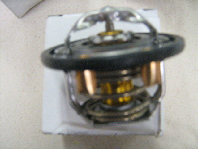 97241130 - Cooling System: Thermostat for Chevrolet: Express 2500, Express 3500, Express 4500, Silverado 2500 HD, Silverado 2500 HD Classic, Silverado 3500, Silverado 3500 Classic, Silverado 3500 HD | GMC: Savana 2500, Savana 3500, Savana 4500, Sierra 2500 HD, Sierra 2500 HD Classic, Sierra 3500, Sierra 3500 Classic, Sierra 3500 HD Image