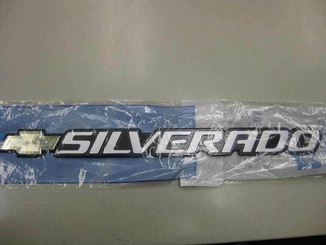 15114063 - Body: Nameplate for Chevrolet: Silverado 1500, Silverado 1500 Classic, Silverado 1500 HD, Silverado 1500 HD Classic, Silverado 2500, Silverado 2500 HD, Silverado 2500 HD Classic, Silverado 3500, Silverado 3500 Classic, Silverado 3500 HD | GMC: Sierra 1500, Sierra 1500 Classic, Sierra 1500 HD, Sierra 1500 HD Classic, Sierra 2500, Sierra 2500 HD, Sierra 2500 HD Classic, Sierra 3500, Sierra 3500 Classic, Sierra 3500 HD Image