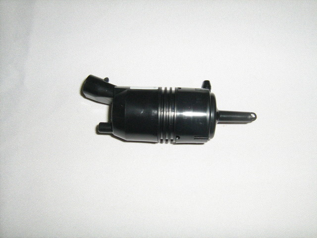 89025062 - Body: Washer Pump for Buick: Century, Commercial Chassis, Electra, LeSabre, Park Avenue, Rainier, Reatta, Regal, Rendezvous, Riviera, Roadmaster, Skyhawk, Skylark | Cadillac: 60 Special, Allante, Brougham, Cimarron, DeVille, Eldorado, Escalade, Escalade ESV, Escalade EXT, Fleetwood, Seville | Chevrolet: Astro, Avalanche 1500, Avalanche 2500, Beretta, Blazer, C/K Pickup, C1500, C2500, C3500, C3500HD, Camaro, Caprice, Cavalier, Celebrity, Classic, Colorado, Corsica, Corvette, Express 1500, Express 2500, Express 3500, Express 4500, Impala, K1500 Pickup, K2500 Pickup, K3500 Pickup, K5 Blazer, Lumina, Lumina APV, Malibu, Monte Carlo, P30, R10, R20, R2500, R30, R3500, S10, S10 Blazer, Silverado 1500, Silverado 1500 Classic, Silverado 1500 HD, Silverado 1500 HD Classic, Silverado 2500, Silverado 2500 HD, Silverado 2500 HD Classic, Silverado 3500, Silverado 3500 Classic, Silverado 3500 HD, SSR, Suburban 1500, Suburban 2500, Suburban C10, Suburban C1500, Suburban C20, Suburban C2500, Suburban K10, Suburban K1500, Suburban K20, Suburban K2500, Suburban R10, Suburban R1500, Suburban R20, Suburban R2500, Suburban V10, Suburban V1500, Suburban V20, Suburban V2500, Tahoe, Trailblazer, Trailblazer EXT, V10, V20, V30, V3500, Venture | GMC: C1500 Pickup, C2500 Pickup, C3500 Pickup, C3500HD, Canyon, Envoy, Envoy XL, Envoy XUV, Jimmy, Jimmy S15, K1500 Pickup, K2500 Pickup, K3500 Pickup, P3500, R1500 Pickup, R2500 Pickup, R3500 Pickup, S15, Safari, Savana 1500, Savana 2500, Savana 3500, Savana 4500, Sierra 1500, Sierra 1500 Classic, Sierra 1500 HD, Sierra 1500 HD Classic, Sierra 2500, Sierra 2500 HD, Sierra 2500 HD Classic, Sierra 3500, Sierra 3500 Classic, Sierra 3500 HD, Sonoma, Suburban C1500, Suburban C2500, Suburban K1500, Suburban K2500, Suburban R1500, Suburban R2500, Syclone, Typhoon, V1500, V1500 Suburban, V2500, V2500 Suburban, V3500, Yukon, Yukon XL 1500, Yukon XL 2500 | Oldsmobile: 88, 98, Achieva, Alero, Aurora, Bravada, Calais, Custom Cruiser, Cutlass, Cutlass Calais, Cutlass Ciera, Cutlass Cruiser, Cutlass Supreme, Delta 88, Firenza, Intrigue, LSS, Regency, Silhouette, Toronado | Pontiac: 6000, Aztek, Bonneville, Fiero, Firebird, Grand Am, Grand Prix, J2000 Sunbird, Montana, Safari, Sunbird, Sunfire, Trans Sport Image