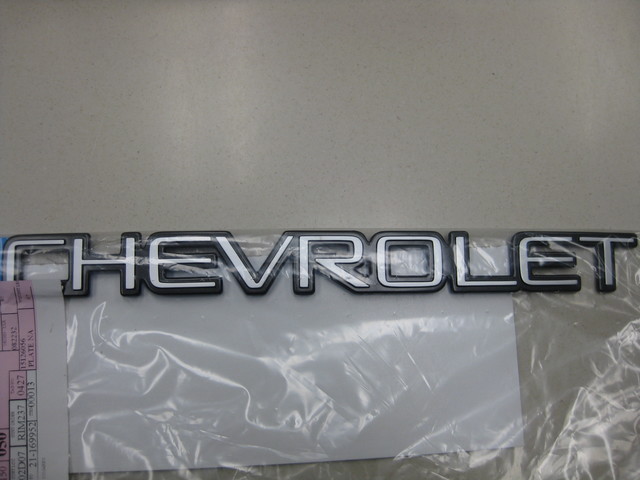 15126056 - Body: Nameplate for Chevrolet: Blazer, Express 1500, Express 2500, Express 3500, P30, S10, S10 Blazer, Silverado 1500, Silverado 1500 Classic, Silverado 1500 HD, Silverado 1500 HD Classic, Silverado 2500, Silverado 2500 HD, Silverado 2500 HD Classic, Silverado 3500, Silverado 3500 Classic, Silverado 3500 HD, Suburban 1500, Suburban 2500, Tahoe | GMC: Sierra 1500, Sierra 1500 Classic, Sierra 1500 HD, Sierra 1500 HD Classic, Sierra 2500, Sierra 2500 HD, Sierra 2500 HD Classic, Sierra 3500, Sierra 3500 Classic, Sierra 3500 HD Image