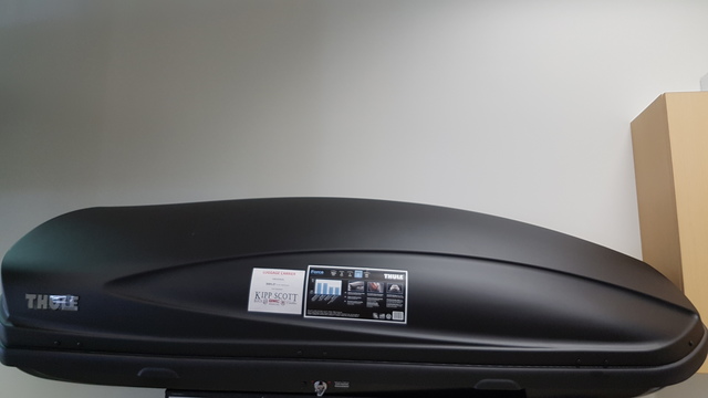 19419504 - Cargo Management: Roof Mounted - Cargo Box (17 Cubic Feet) for Buick: Enclave, Envision, Regal Sportback, Regal TourX | Cadillac: CTS, Escalade, Escalade ESV, Escalade EXT, LYRIQ, XT4, XT5, XT6 | Chevrolet: Avalanche, Blazer, Colorado, Equinox, Equinox EV, Silverado 1500, Silverado 1500 LTD, Silverado 2500 HD, Silverado 3500 HD, Silverado EV, Suburban, Suburban 1500, Suburban 2500, Suburban 3500 HD, Tahoe, Traverse | GMC: Acadia, Acadia Limited, Canyon, Sierra 1500, Sierra 1500 Limited, Sierra 2500 HD, Sierra 3500 HD, Sierra EV, Terrain, Yukon, Yukon XL, Yukon XL 1500, Yukon XL 2500 Image