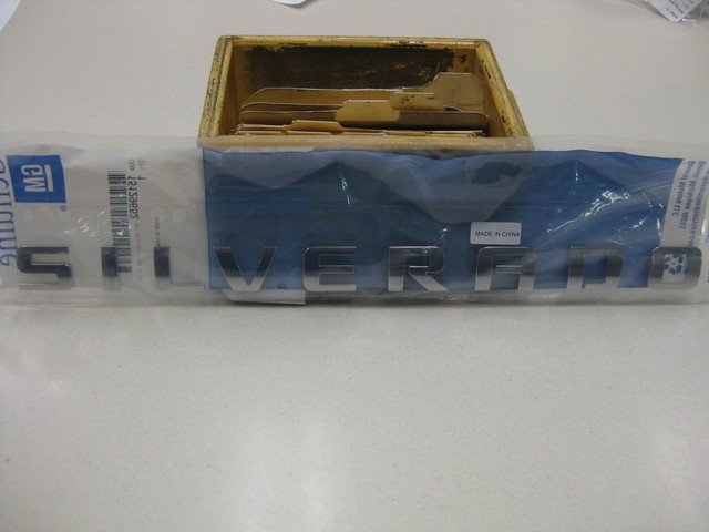 15129652 - Body: Nameplate for Chevrolet: Silverado 1500, Silverado 1500 LD, Silverado 2500 HD, Silverado 3500 HD | GMC: Sierra 1500, Sierra 1500 Limited, Sierra 2500 HD, Sierra 3500 HD Image