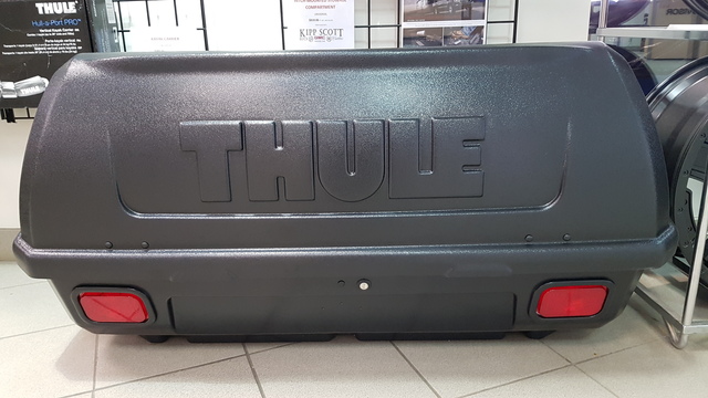 19257871 - Cargo Management - Exterior: Hitch-Mounted Stowage Compartment - Cargo Box for Buick: Enclave, Envision | Cadillac: CTS, Escalade, Escalade ESV, Escalade EXT, SRX, XT4, XT5, XT6 | Chevrolet: Avalanche, Blazer, Colorado, Equinox, Express 1500, Express 2500, Express 3500, Express 4500, HHR, Silverado 1500, Silverado 1500 Classic, Silverado 1500 HD Classic, Silverado 1500 LTD, Silverado 2500 HD, Silverado 2500 HD Classic, Silverado 3500 Classic, Silverado 3500 HD, Suburban, Suburban 1500, Suburban 2500, Suburban 3500 HD, Tahoe, Trailblazer, Traverse | GMC: Acadia, Acadia Limited, Canyon, Envoy, Savana 1500, Savana 2500, Savana 3500, Savana 4500, Sierra 1500, Sierra 1500 Classic, Sierra 1500 HD Classic, Sierra 1500 Limited, Sierra 2500 HD, Sierra 2500 HD Classic, Sierra 3500 Classic, Sierra 3500 HD, Terrain, Yukon, Yukon XL, Yukon XL 1500, Yukon XL 2500 Image