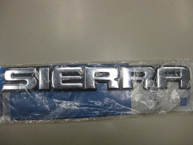 15114064 - Body: Nameplate for Chevrolet: Silverado 1500, Silverado 1500 Classic, Silverado 1500 HD, Silverado 1500 HD Classic, Silverado 2500, Silverado 2500 HD, Silverado 2500 HD Classic, Silverado 3500, Silverado 3500 Classic, Silverado 3500 HD | GMC: Sierra 1500, Sierra 1500 Classic, Sierra 1500 HD, Sierra 1500 HD Classic, Sierra 2500, Sierra 2500 HD, Sierra 2500 HD Classic, Sierra 3500, Sierra 3500 Classic, Sierra 3500 HD Image