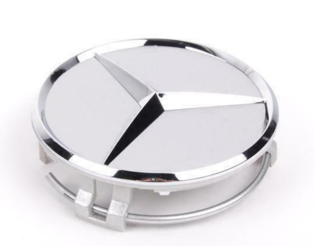 66470202 - Wheels: Wheel Hub Insert - Silver Cap Silver Logo for Mercedes-Benz: B Electric Drive, B250e, C250, C300, C350, C63 AMG, CLA250, CLA45 AMG, CLK320, CLK350, CLK500, CLK55 AMG, CLK550, CLK63 AMG, CLS400, CLS500, CLS55 AMG, CLS550, CLS63 AMG, CLS63 AMG S, E350, E400, E550, E63 AMG, GL320, GL350, GL450, GL550, GL63 AMG, GLA250, GLA45 AMG, GLC300, GLC350e, GLC43 AMG, GLC63 AMG, GLC63 AMG S, GLE300d, GLE350, GLE400, GLE43 AMG, GLE450 AMG, GLE550e, GLE63 AMG, GLE63 AMG S, GLK250, GLK350, GLS350d, GLS450, GLS550, GLS63 AMG, ML320, ML350, ML450, ML500, ML550, ML63 AMG, R320, R350, R500, SL55 AMG, SL550, SL600, SL63 AMG, SL65 AMG, SLC300, SLC43 AMG, SLK250, SLK280, SLK300, SLK350, SLK55 AMG, SLR McLaren, SLS AMG, Sprinter 2500, Sprinter 3500 Image