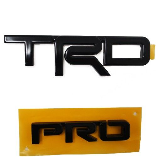 PT41335170 - Exterior: Genuine Toyota Tacoma TRD PRO Metal Tailgate Badge/Emblem Satin Black for Toyota: Tacoma Image