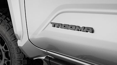 PT9483524411 - Exterior: Genuine Toyota 2024 + Tacoma SR5 Gunmetal Gray Emblem Overlay Set for Toyota: Tacoma Image