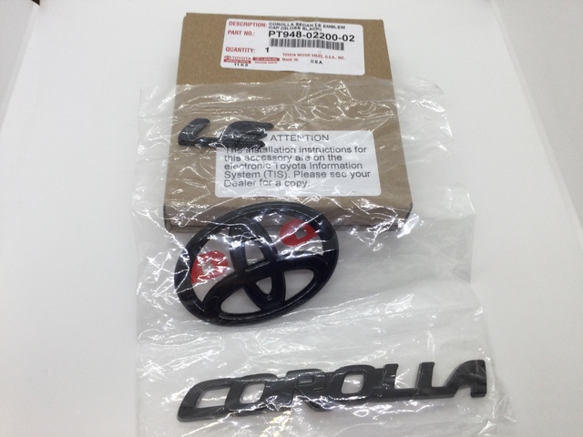 PT9480220002 - Exterior: Genuine Toyota 2020 &amp; Up Corolla LE Sedan Black Emblem Overlays Set/Kit for Toyota: Corolla Image