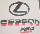 PT90B3326002 - : 2026 GENUINE NEW GLOSS BLACK OUT LEXUS ES 350h AWD EMBLEM OVERLAY PT90B-33260-02 for Lexus Image
