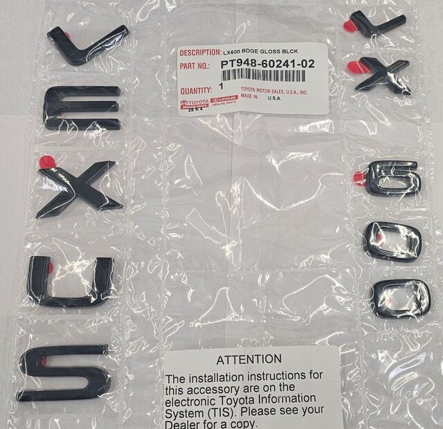 PT9486024102 - Exterior: Black Emblem Overlays - LX600 for Lexus: LX600, LX700h Image